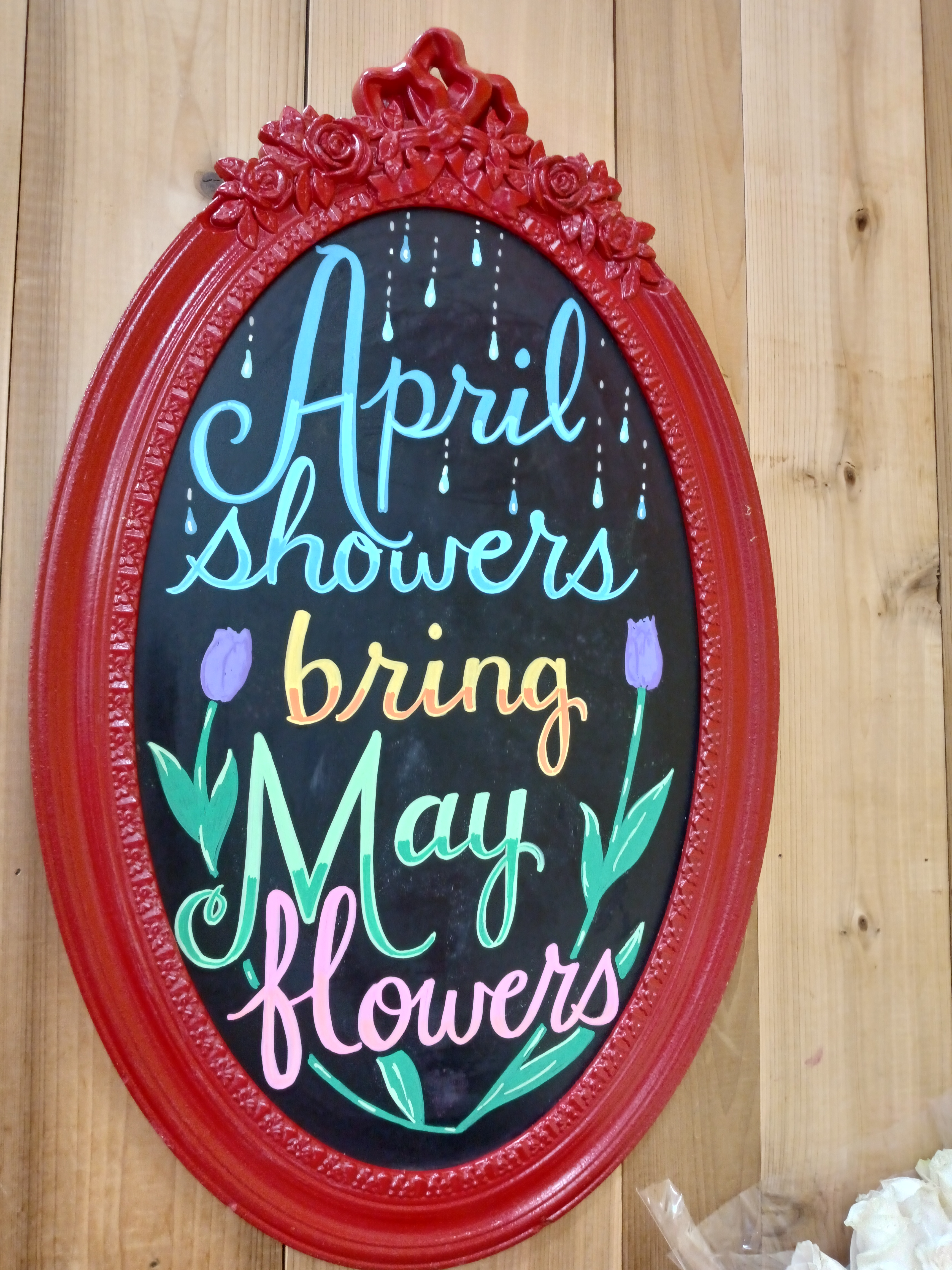 April Showers Bring May Flowers — hand-painted oval chalkboard sign