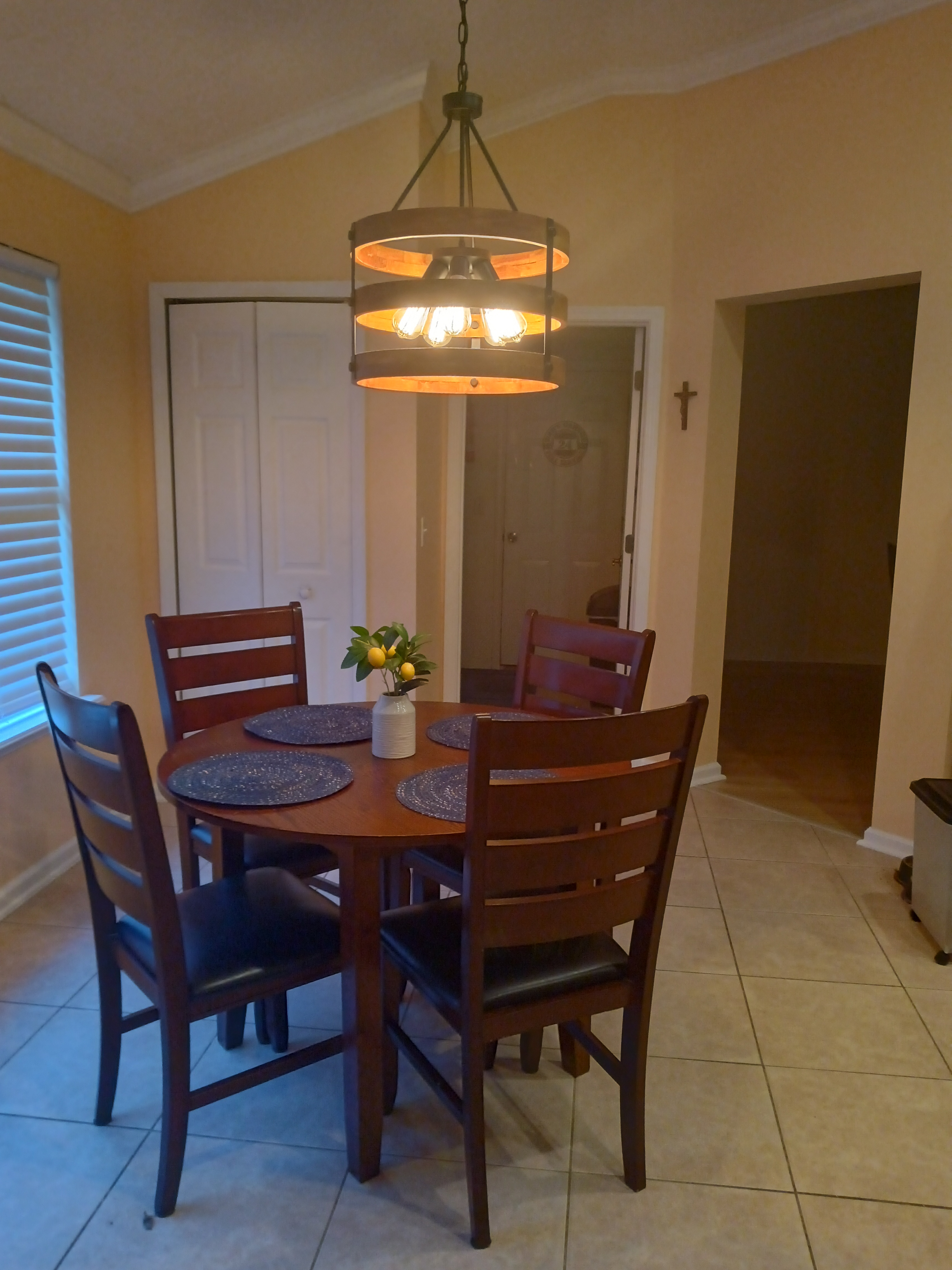 Dining room with pendant drum lighting