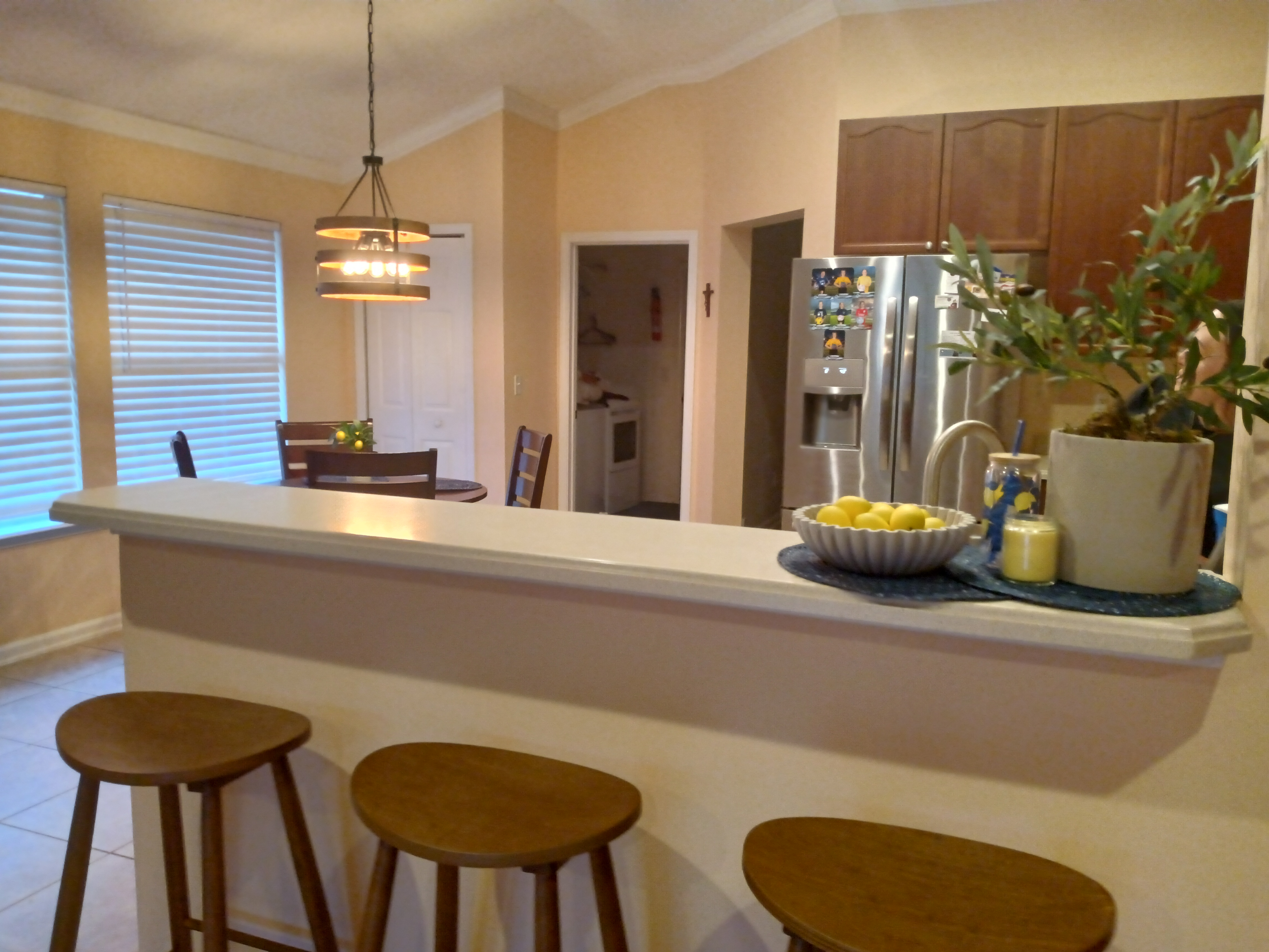 Kitchen bar area with bar stools and lemon decor