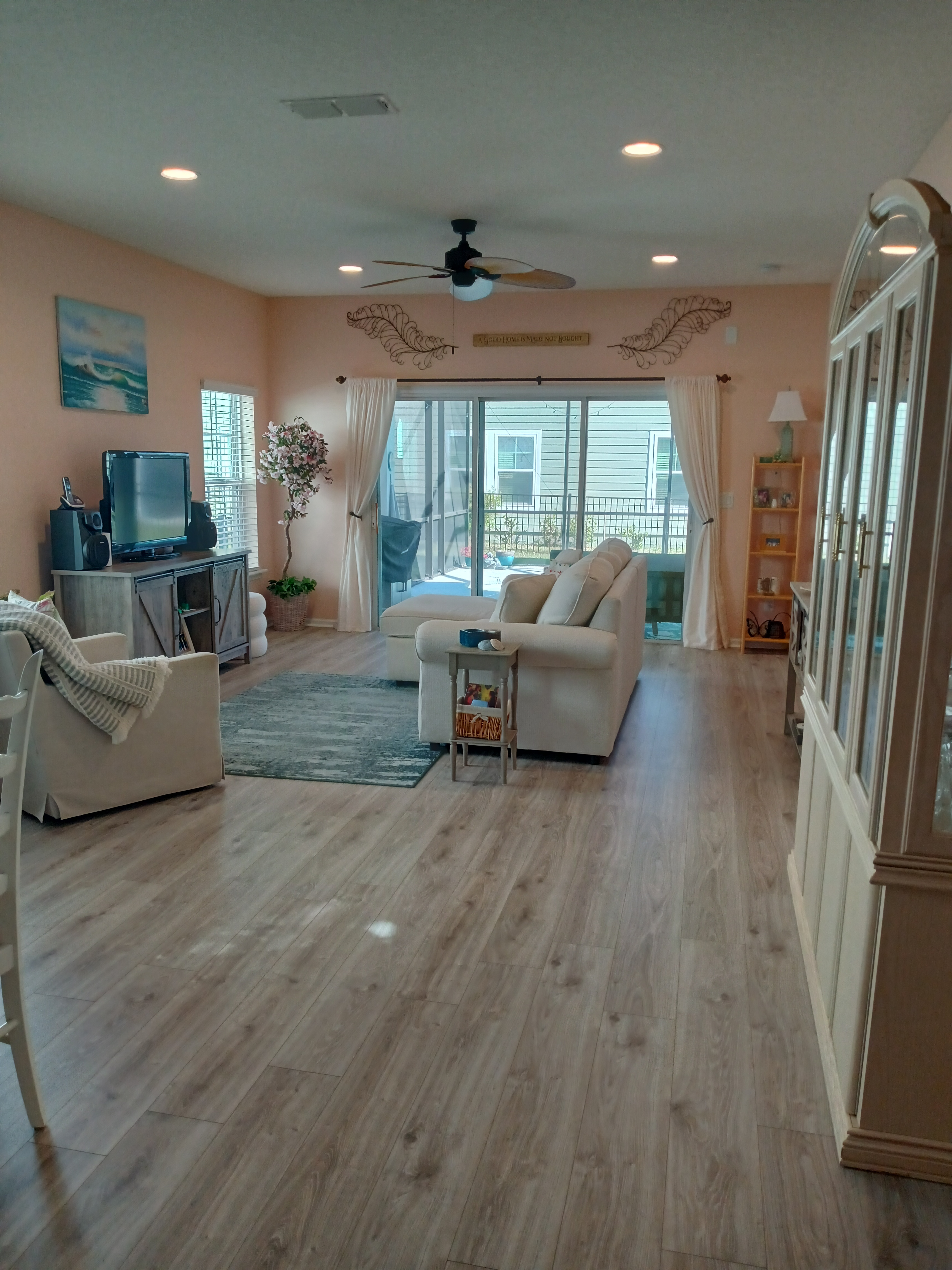 Rattan sofa with tropical leaf cushions