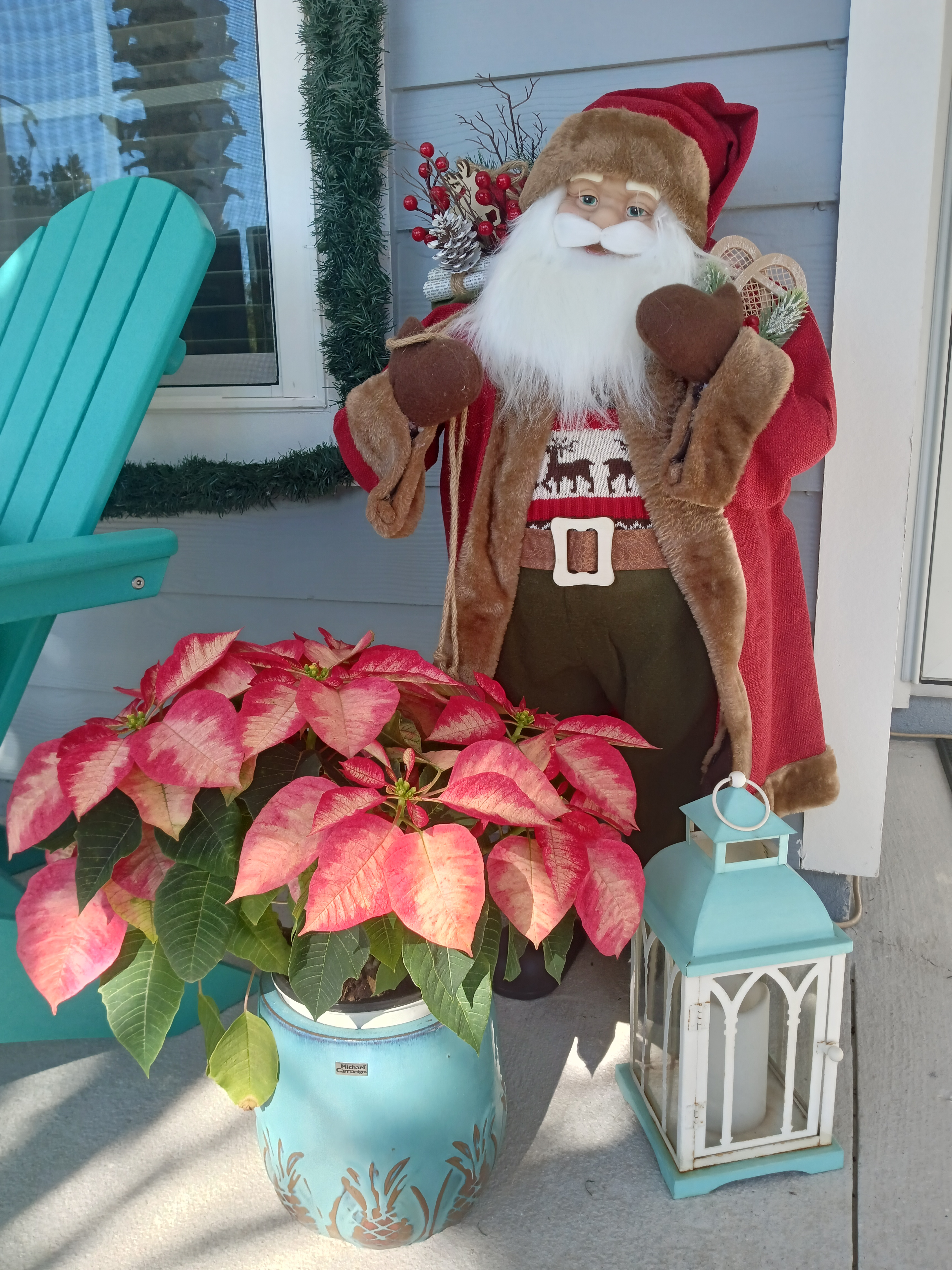 Christmas porch with Santa and poinsettia